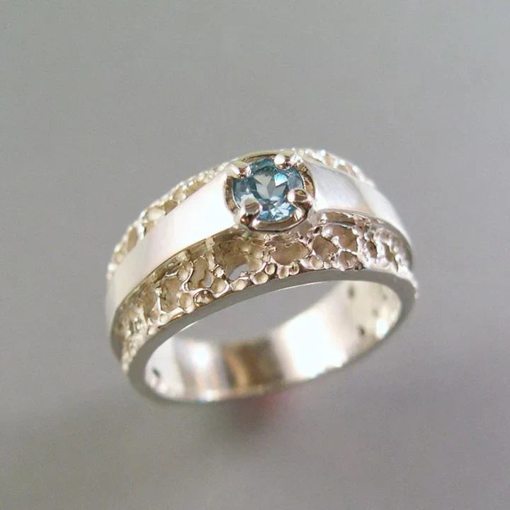 Bague vintage en or et argent creux avec verre bleu