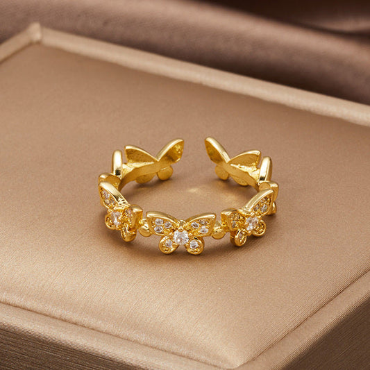 Bague ajustable papillons en or