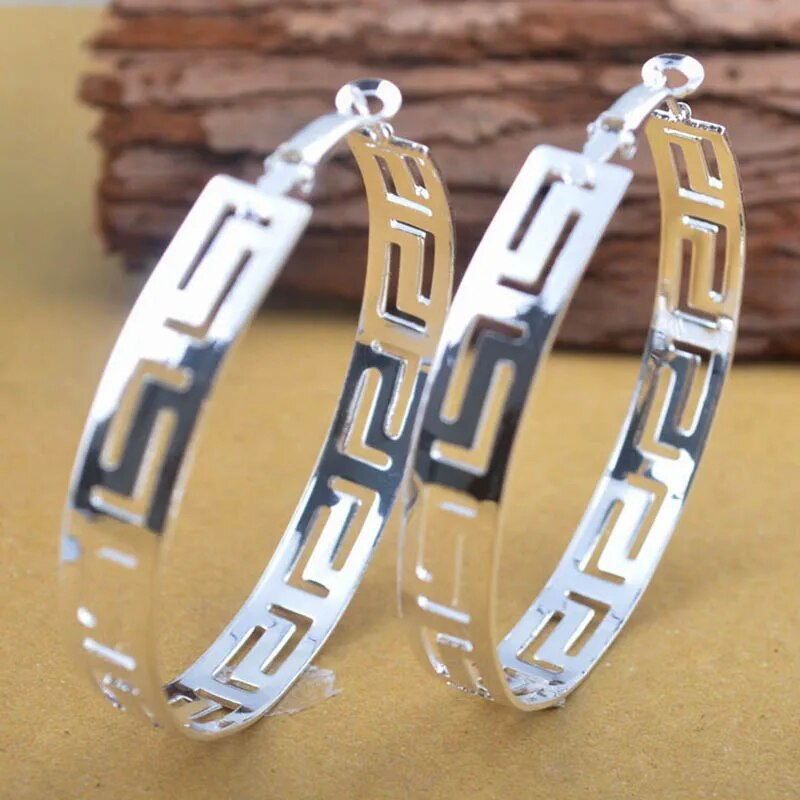 Boucles d'oreilles creuses vintage en or et argent